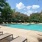 Large sparkling pool with sundecks and ample lounge chairs.