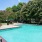 Large sparkling pool with sundecks and ample lounge chairs.