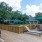 Large wooden pool deck with ample seating 