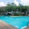 Large sparkling pool with sundecks and ample lounge chairs.